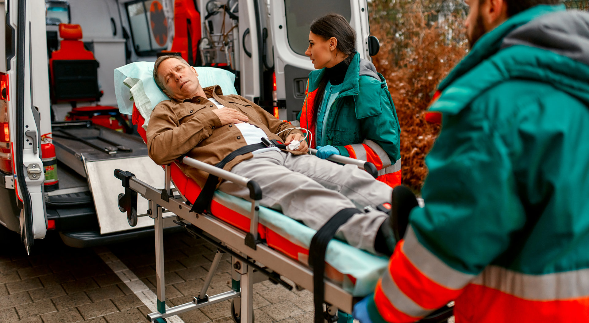 caregiver assist the man in a wheelchair