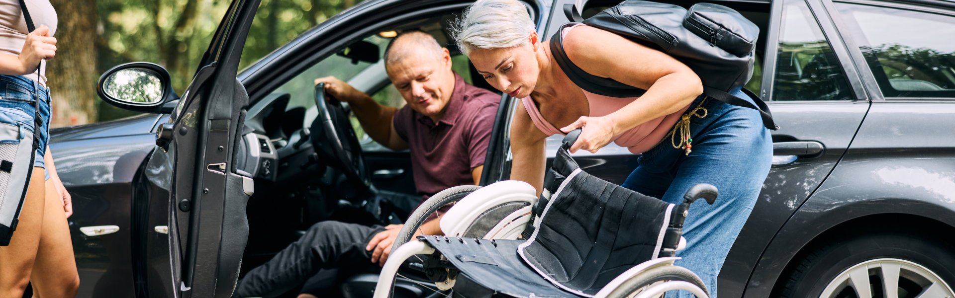 woman folding a wheelchair
