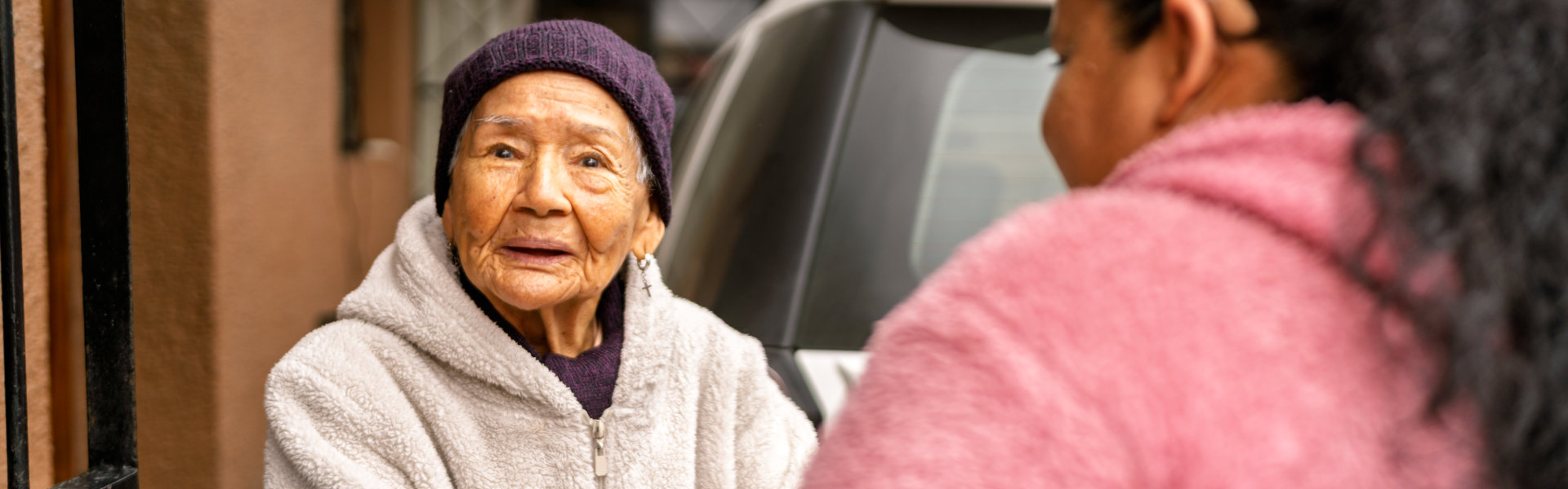 caregiver assist the elderly woman